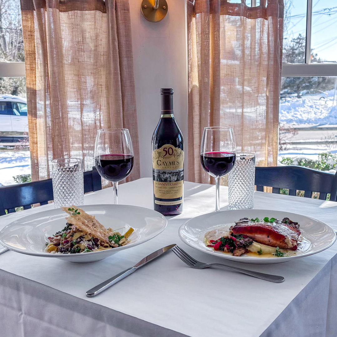 Wine Down Wednesday featuring Salmon and Duck Pasta, Caymus Bottle of red Wine with 2 glasses poured.